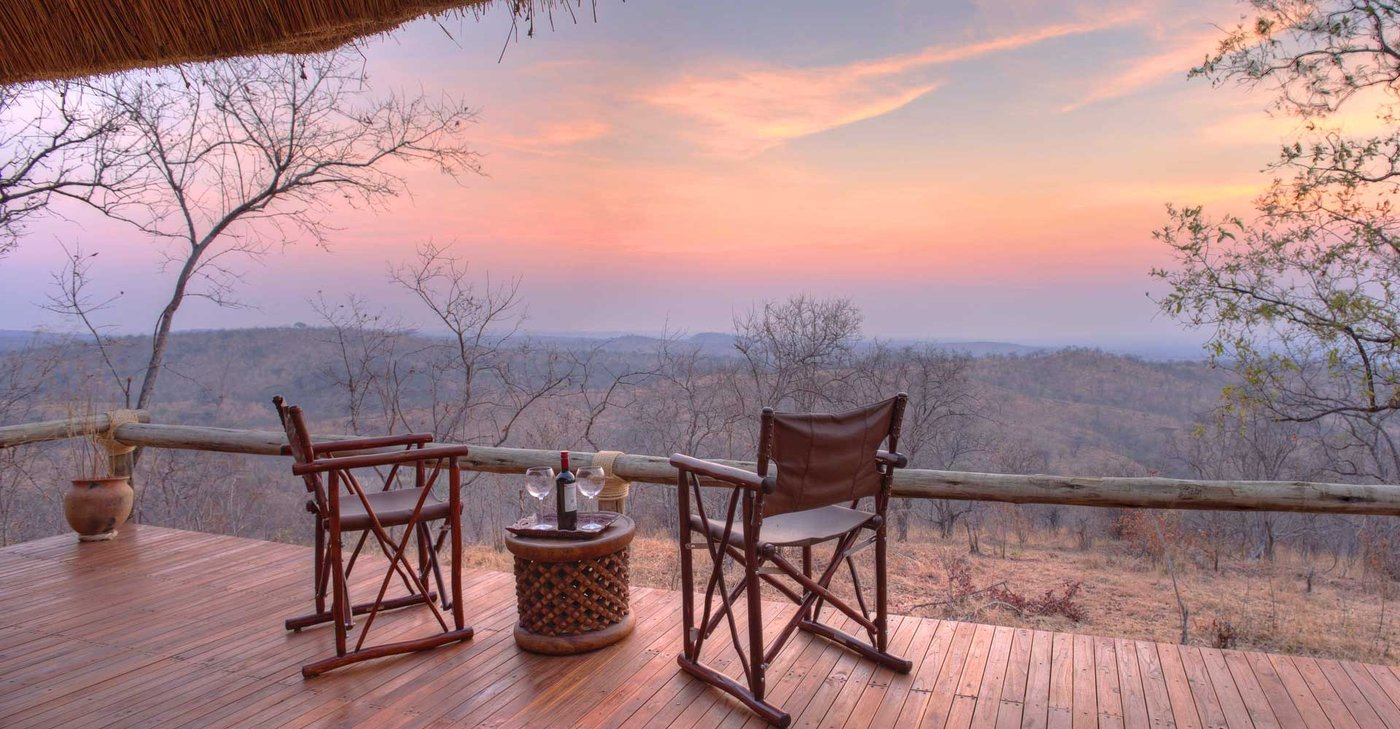 Director's chairs on a private deck overlooking the escarpment at Ikuka Safari Camp