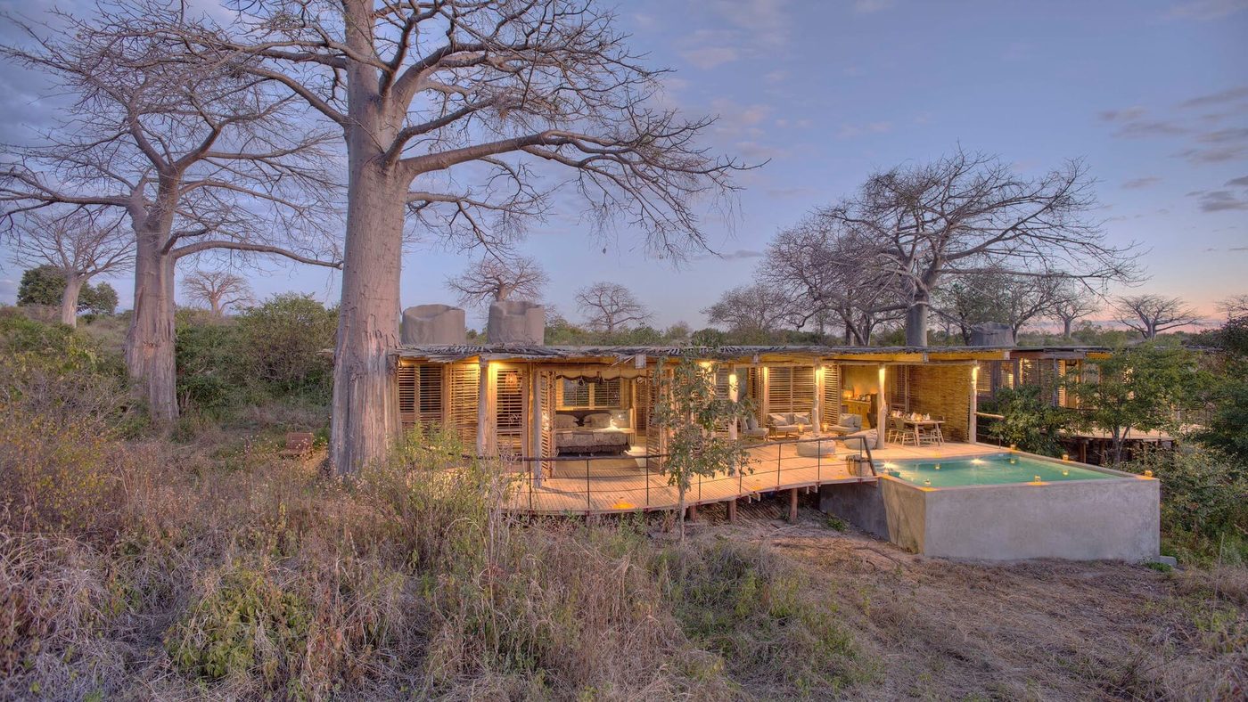 Private villa with pool nestled among baobab trees at dusk at Jabali Private House in Ruaha