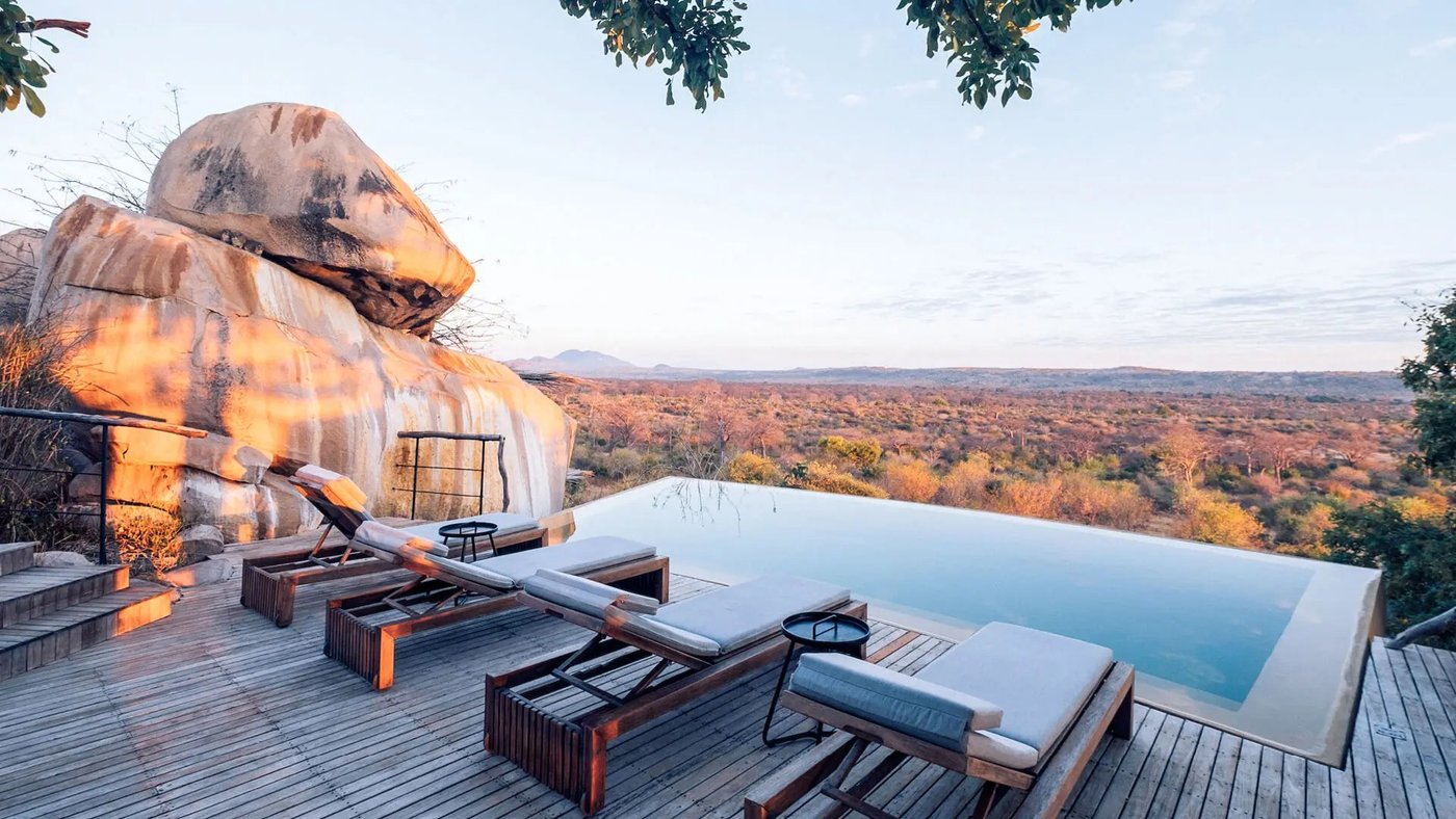 Infinity pool built into granite boulders overlooking the plains at Jabali Ridge