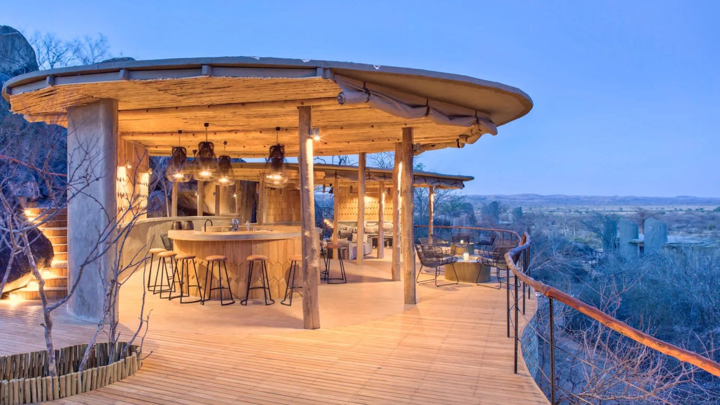 Curved bar and lounge deck looking over the valley at Jabali Ridge